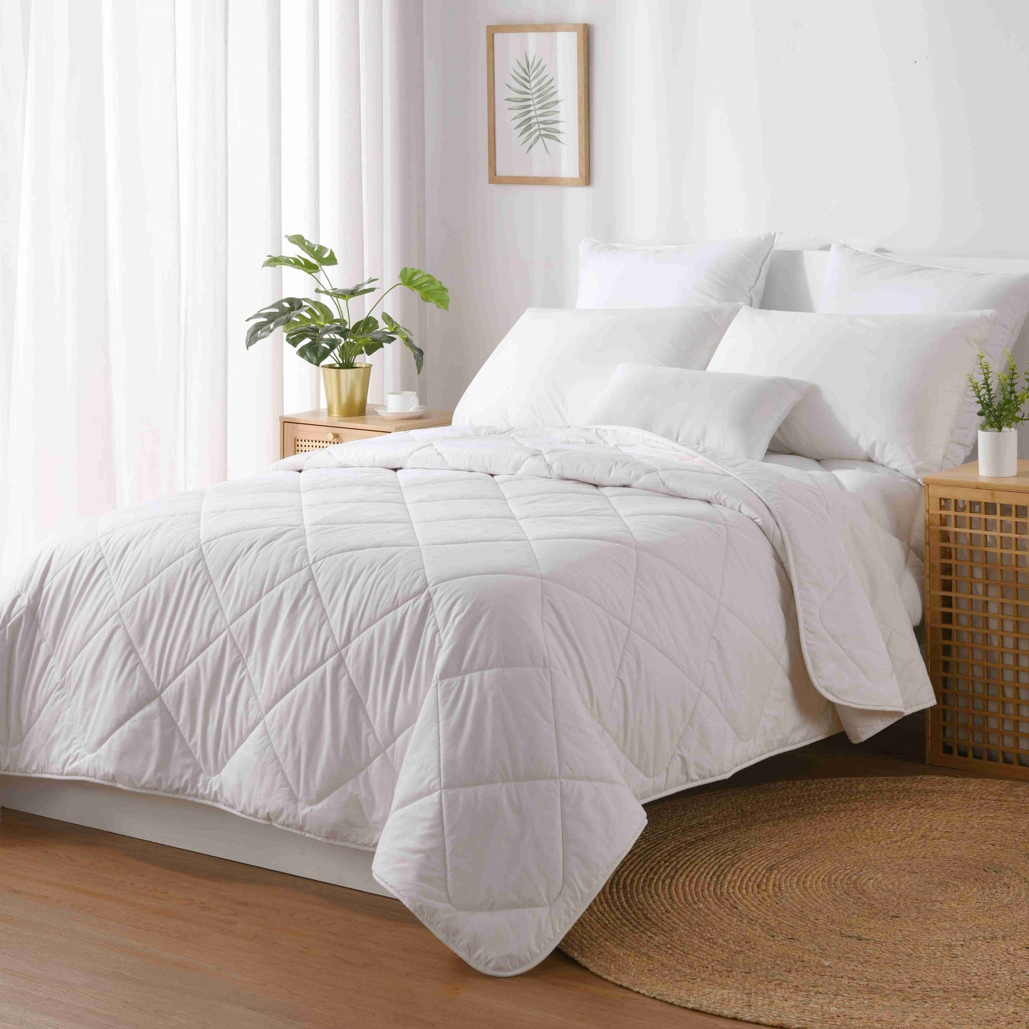 A rolled up Australian wool quilt on a white background.